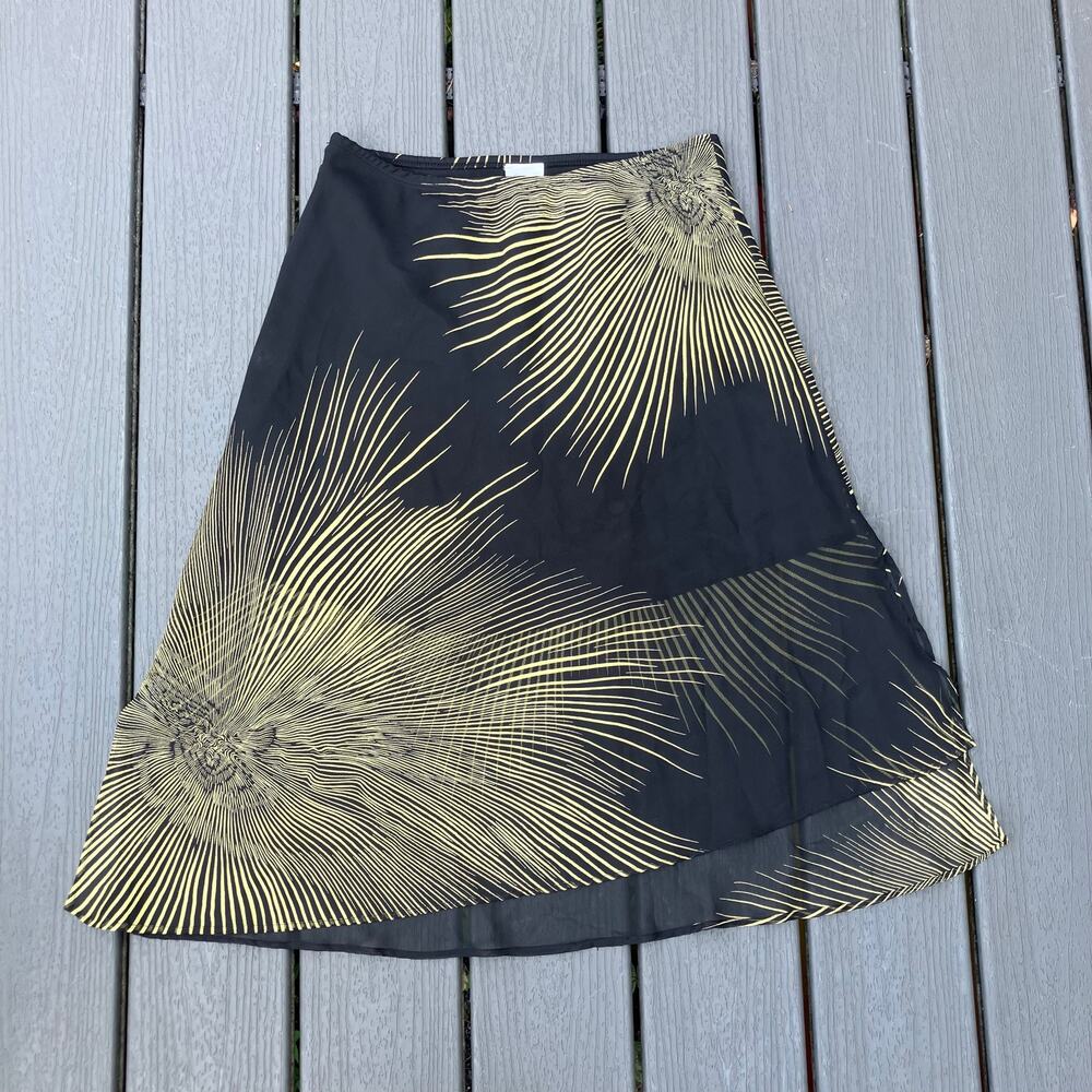 Black asymmetric hem midi skirt with slits and sheer overlay, burst detail, boho